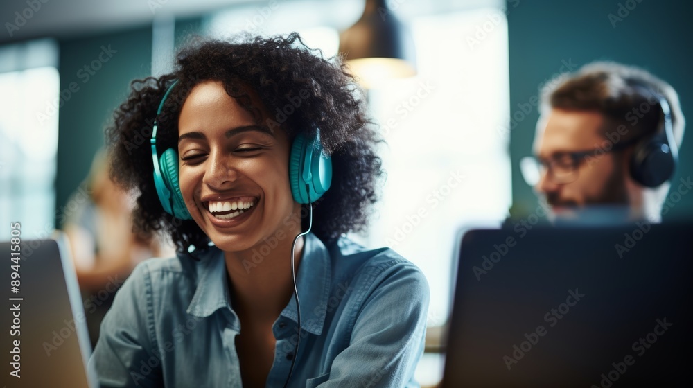 Portrait of a cheerful young Caucasian contact center telemarketing agent gesturing heart form with hands while chatting on headset in workplace. Positive businesswoman running helpdesk for customer Portrait of a cheerful young Caucasian contact center telemarketing agent gesturing heart form with hands while chatting on headset in workplace. Positive businesswoman running helpdesk for customer