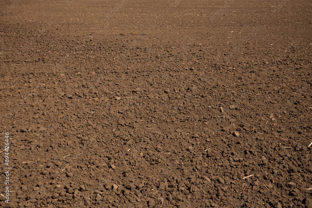 Plowed field, earth natural texture, farming background Plowed field, earth natural texture, farming background