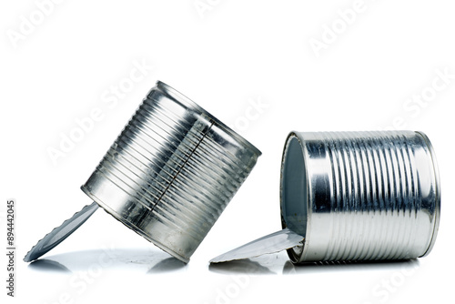 Old empty tin cans on white background photo