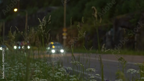 Taipalsaari, Finland, June 28, 2024: Saimaa cycle tour. Cycling competitions. Cyclist. Cyclists race. Group of cyclists riding bicycles down the road in the rural area. Slow motion video photo