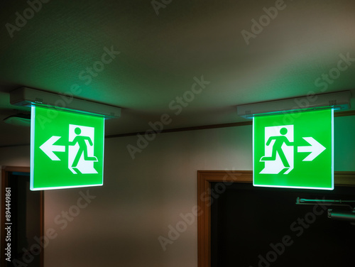 Emergency Exit sign doorway green light indoor Public building security system 