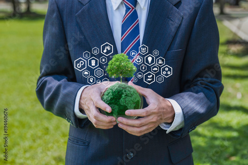 Businessman holding a globe with icon carbon credit reducing to a sustainable climate solution to low carbon economy.