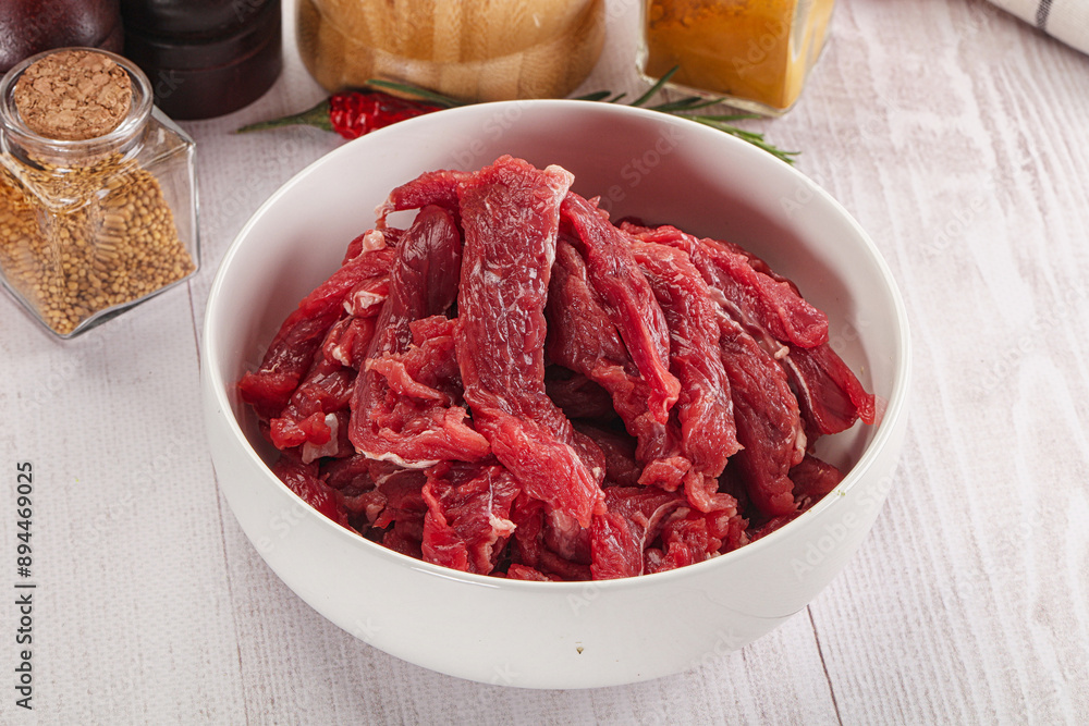 Raw beef meat - sliced strips Raw beef meat - sliced strips