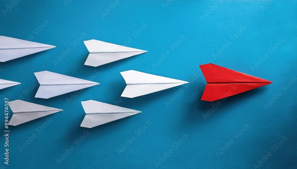 Strategic Business Concept – White Paper Planes Aligned in One Direction Strategic Business Concept – White Paper Planes Aligned in One Direction