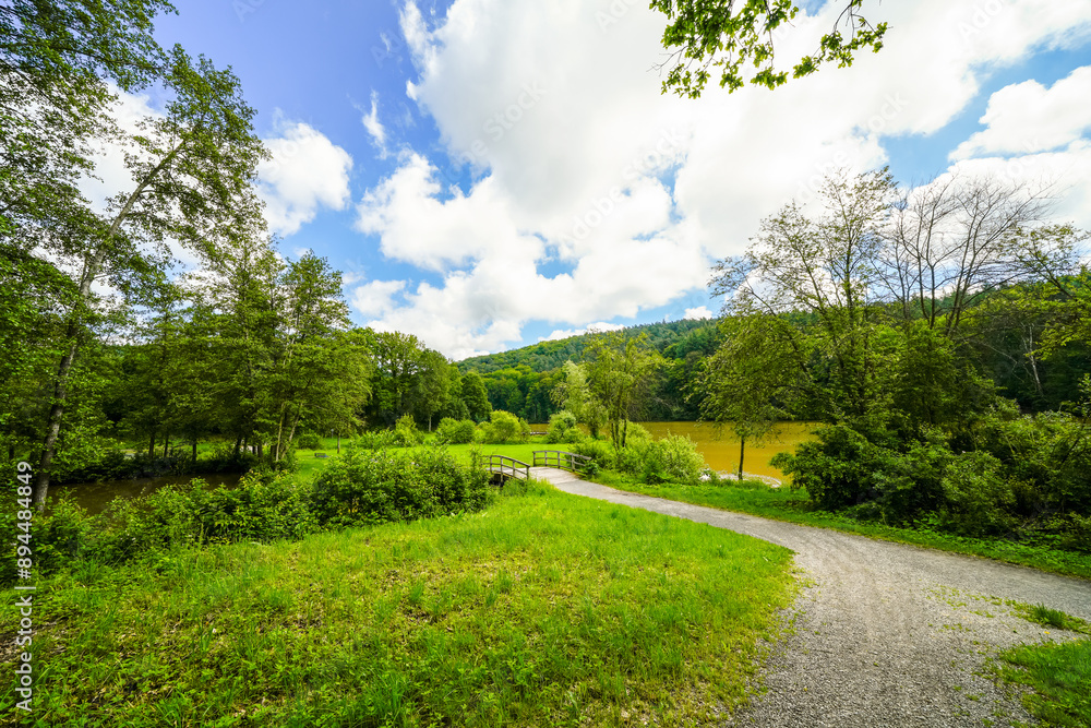 View of the Haunetalsperre and the surrounding nature. Flood retention basin near Marbach in the Fulda district. Landscape at the reservoir.
View of the Haunetalsperre and the surrounding nature. Flood retention basin near Marbach in the Fulda district. Landscape at the reservoir.
