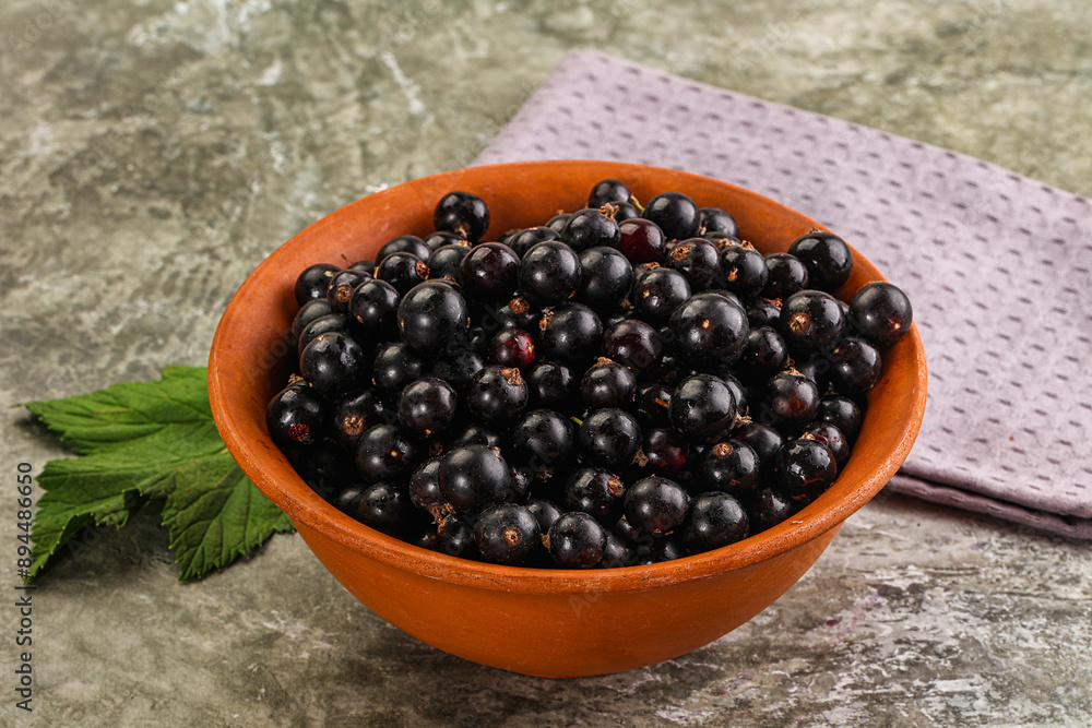 Ripe black currant in the bowl Ripe black currant in the bowl