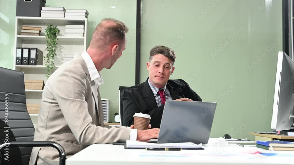 Office colleagues have a casual discussion. During a meeting in a conference room, a group of business teem sit Office colleagues have a casual discussion. During a meeting in a conference room, a group of business teem sit