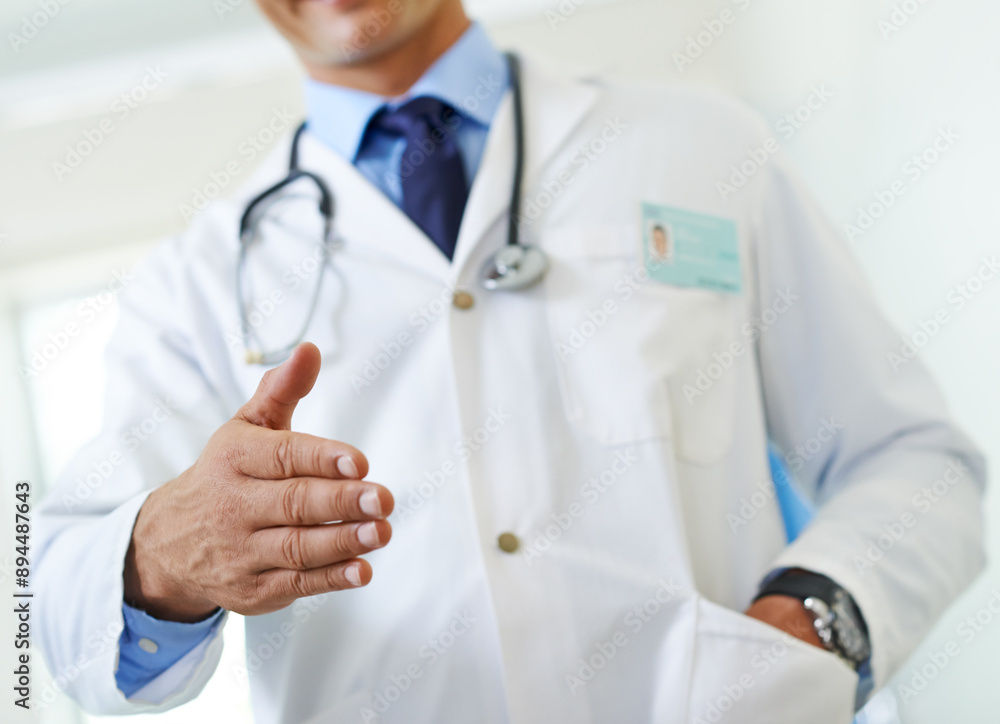 Doctor, handshake and greeting gesture in hospital, man and welcome introduction for patient consultation. Clinic, professional and friendly man or healthcare employee, respect and trust for checkup Doctor, handshake and greeting gesture in hospital, man and welcome introduction for patient consultation. Clinic, professional and friendly man or healthcare employee, respect and trust for checkup