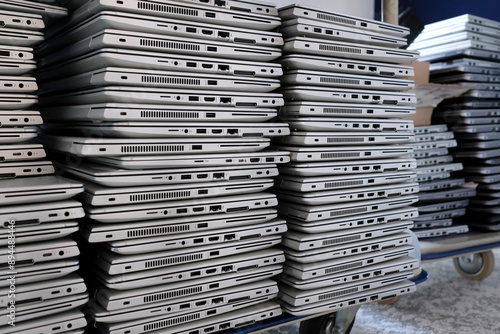Big stacks of discarded laptops, notebooks on a trolley