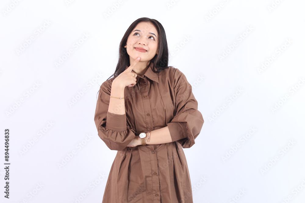 Beautiful young Asian woman in brown dress. Charming female lady standing pose thinking on isolated white blank background. Asian cute people Beautiful young Asian woman in brown dress. Charming female lady standing pose thinking on isolated white blank background. Asian cute people