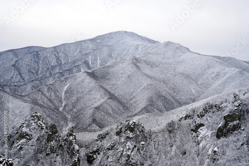 High angle and morning view of snow covered rocks and peaks of Jujeongol Valley against Daecheongbong Peak at Seoraksan Mountain of Osaek-ri near Yangyang-gun, South Korea
 photo