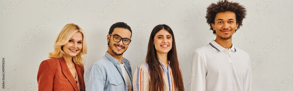Group of diverse people standing gracefully in front of white backdrop. Group of diverse people standing gracefully in front of white backdrop.