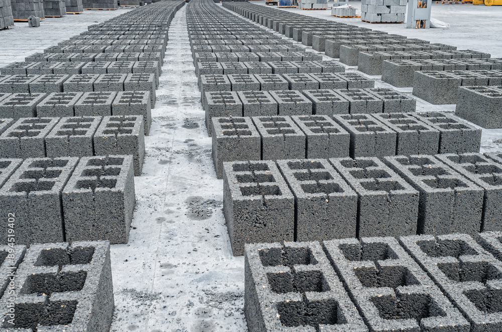 Fototapeta premium Concrete cinder blocks, building material in form of gray bricks. Use on the construction site.