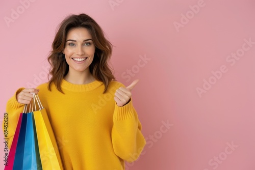 Woman Holding Shopping Bags and Pointing Right