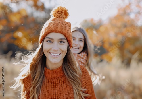 Woman Smiling in Orange Knit Hat During Fall