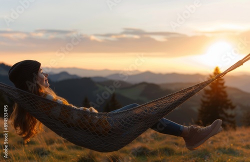 Woman Relaxing in Hammock at Sunset