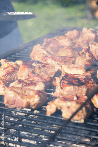 grilled meat on the grill. outdoor ativity in summer photo