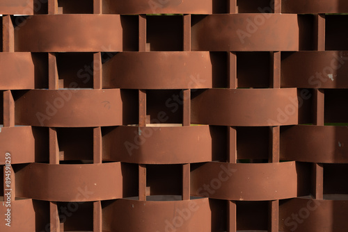 A woven metal wall with a w...