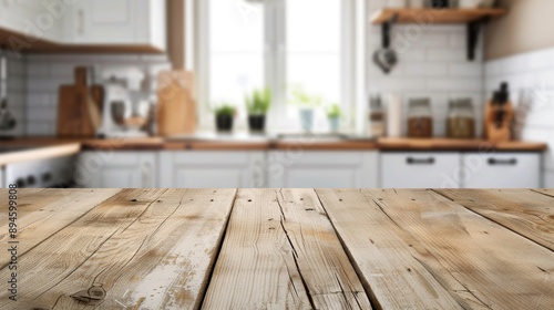 Bare wooden table with blurred kitchen background, blank space © Lasvu