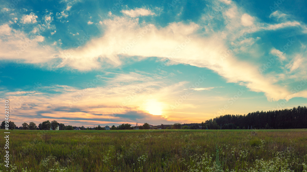 Rural landscape at sunset. Countryside in the evening Rural landscape at sunset. Countryside in the evening
