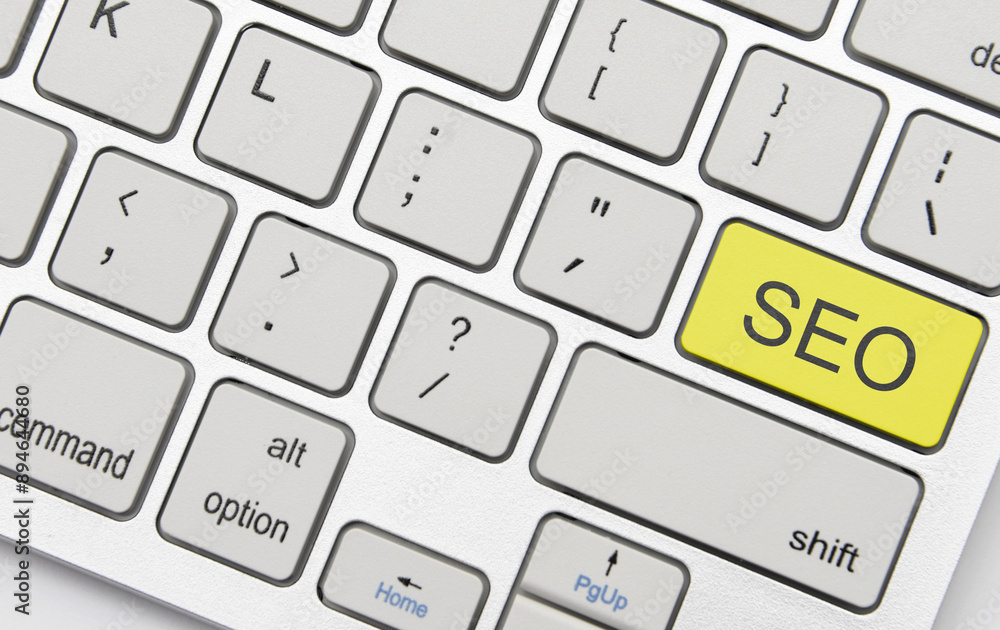 black text seo on the keyboard on a grey background. black text seo on the keyboard on a grey background.