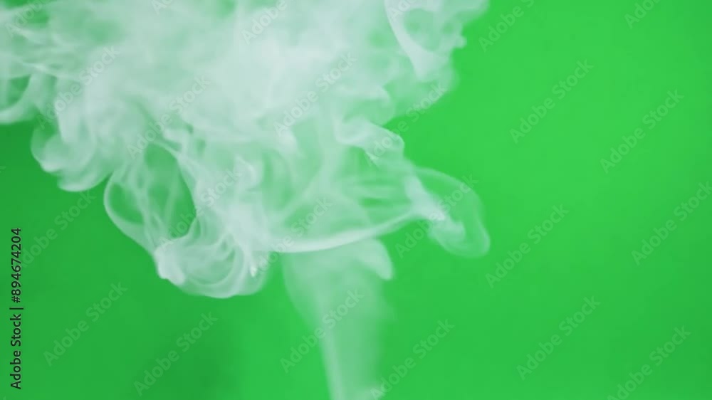 White smoke floating on a green background