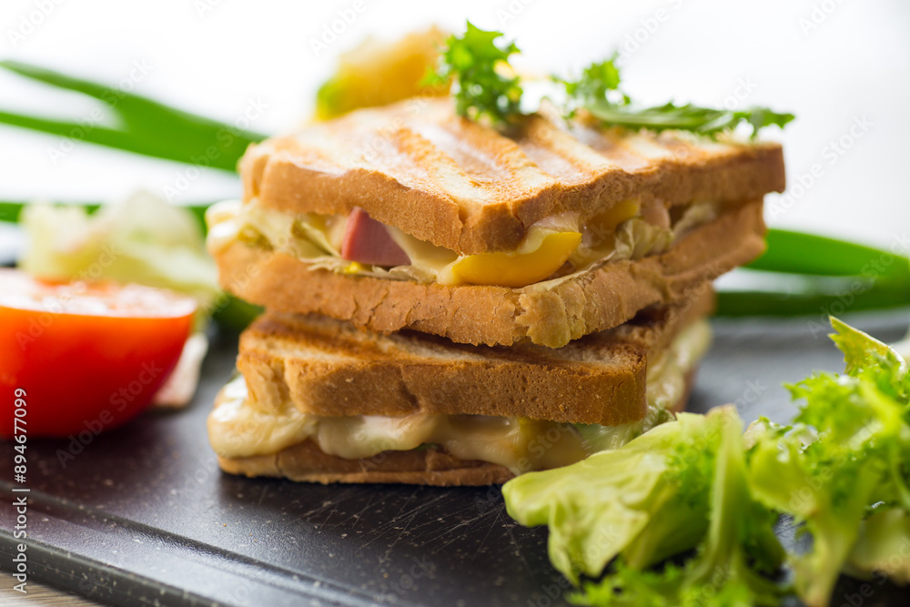 fried toasts with filling, salad leaves, tomatoes fried toasts with filling, salad leaves, tomatoes
