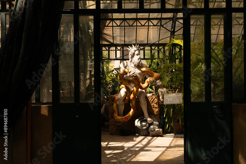 A statue of a man entangled...