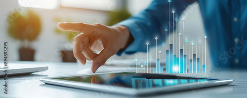 Close-up of a financial advisor's hand pointing to a strategic growth chart on a tablet