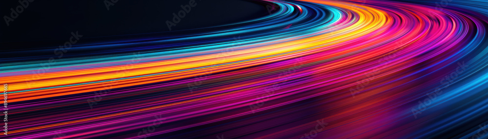 Dynamic abstract image of colorful light trails in motion, creating a vibrant and futuristic effect against a dark background. Dynamic abstract image of colorful light trails in motion, creating a vibrant and futuristic effect against a dark background.