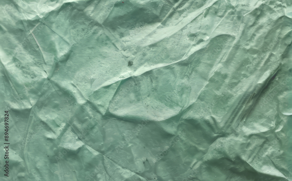 Fototapeta premium abstract background, wrinkled jade color textured paper
