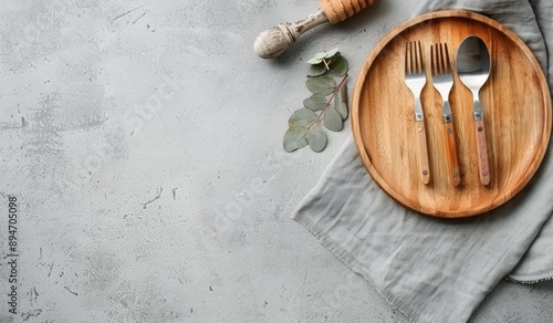 Wooden Plate With Silverware and Napkin