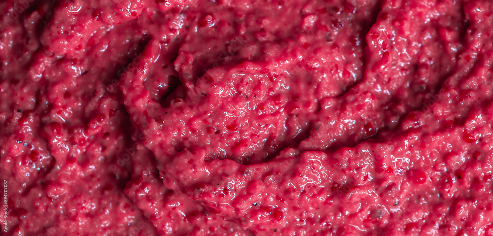 Berry yoghurt ice cream. Smoothies from fresh fruits and berries. Ice cream texture. Delicious sweet dessert close-up as a background. Berry yoghurt ice cream. Smoothies from fresh fruits and berries. Ice cream texture. Delicious sweet dessert close-up as a background.