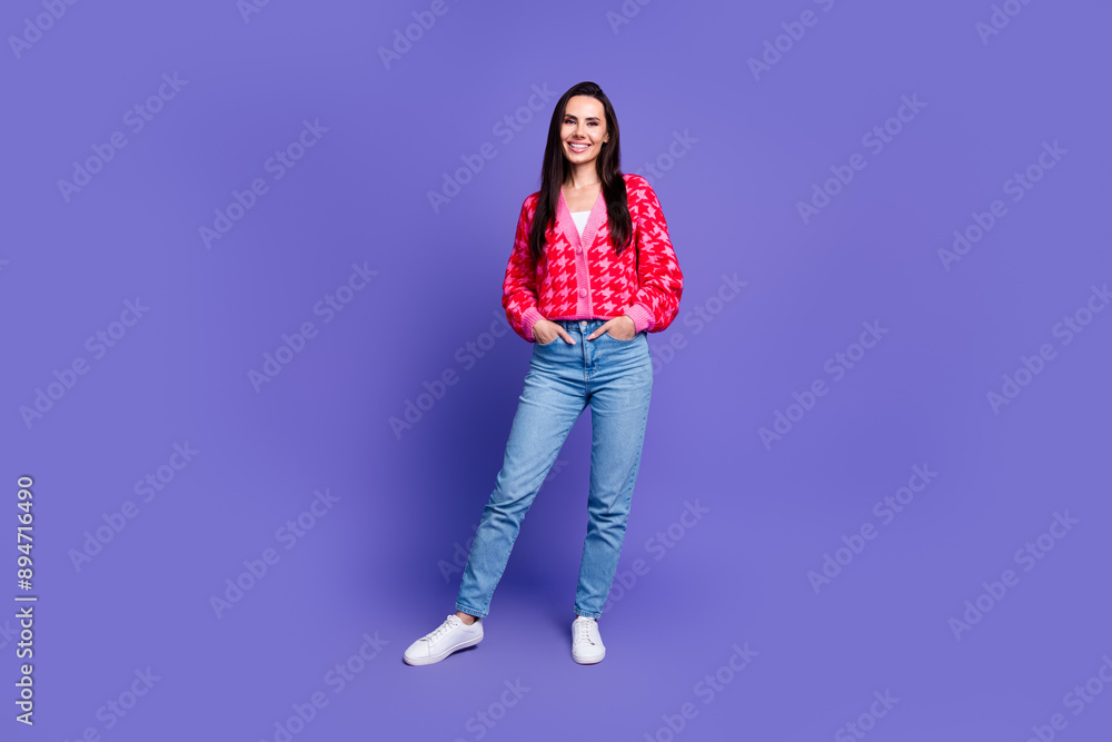 Full length photo of cheerful pretty lady dressed pink cardigan smiling empty space isolated violet color background Full length photo of cheerful pretty lady dressed pink cardigan smiling empty space isolated violet color background