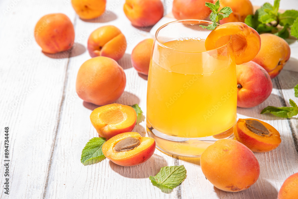 Apricot mojito or lemonade cold fruit drink, summer iced fruit juice non-alcohol mocktail with mint and lemon, on white wooden table
Apricot mojito or lemonade cold fruit drink, summer iced fruit juice non-alcohol mocktail with mint and lemon, on white wooden table
