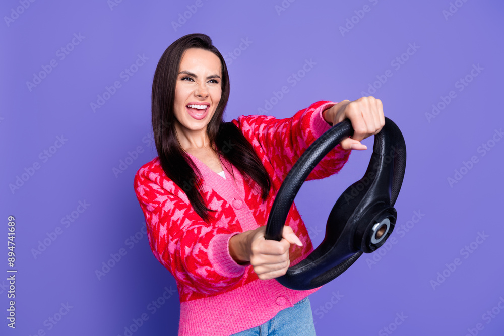 Photo of cheerful cool lady dressed pink cardigan driving car empty space isolated violet color background Photo of cheerful cool lady dressed pink cardigan driving car empty space isolated violet color background