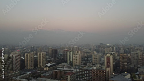 Wallpaper Mural Aerial drone view of Santiago, Chile, shrouded in winter haze with the Andes mountains visible in the background, highlighting the city's foggy atmosphere and dramatic landscape. Torontodigital.ca