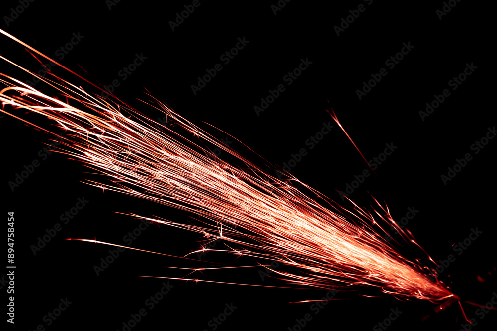 red sparks from the grinder glowing in the dark red sparks from the grinder glowing in the dark