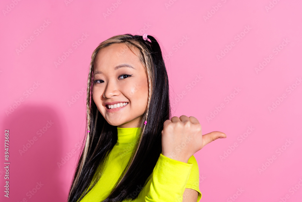 Photo of good mood girl with dyed hairdo dressed yellow turtleneck directing at offer empty space isolated on pink color background Photo of good mood girl with dyed hairdo dressed yellow turtleneck directing at offer empty space isolated on pink color background