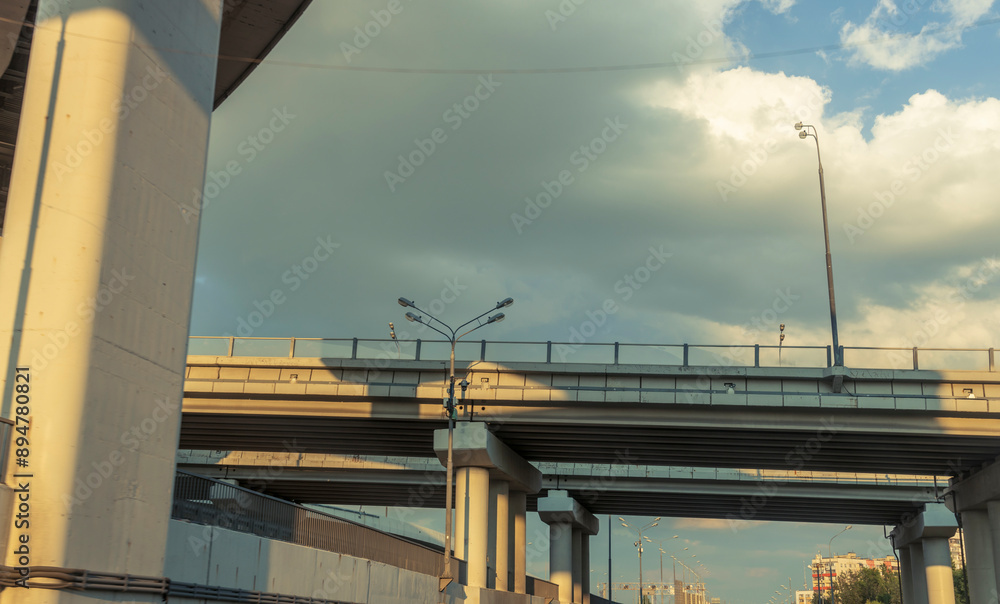 Fototapeta premium A bridge with a cloudy sky in the background