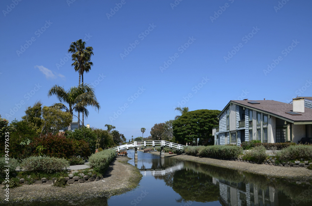 Canals of Venice in California with amazing houses, boats, palm trees on the shore Canals of Venice in California with amazing houses, boats, palm trees on the shore