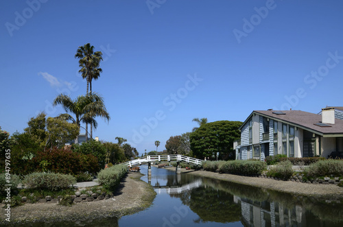 Canals of Venice in California with amazing houses, boats, palm trees on the shore