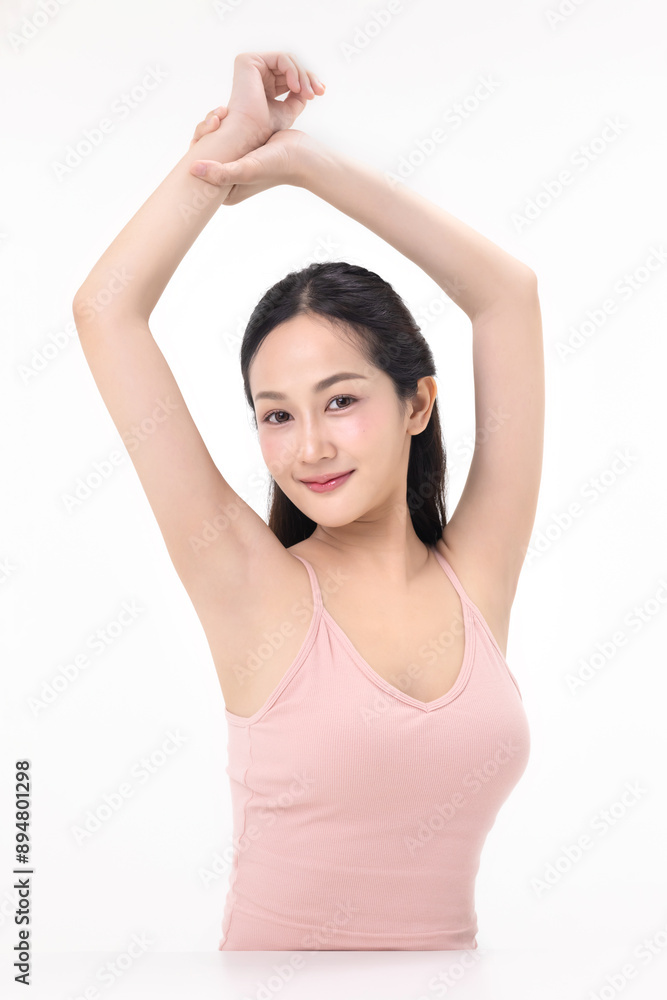 Beautiful young Asian woman lifting hand up to shows off clean and clear armpit or underarms isolated on white background, Smooth and freshness armpit concept. Beautiful young Asian woman lifting hand up to shows off clean and clear armpit or underarms isolated on white background, Smooth and freshness armpit concept.
