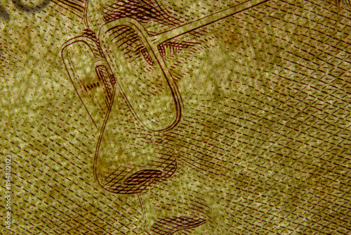 Photograph of banknotes with a magnifying lens Makes it possible to see the delicate lines that the creator has painted on the banknote.