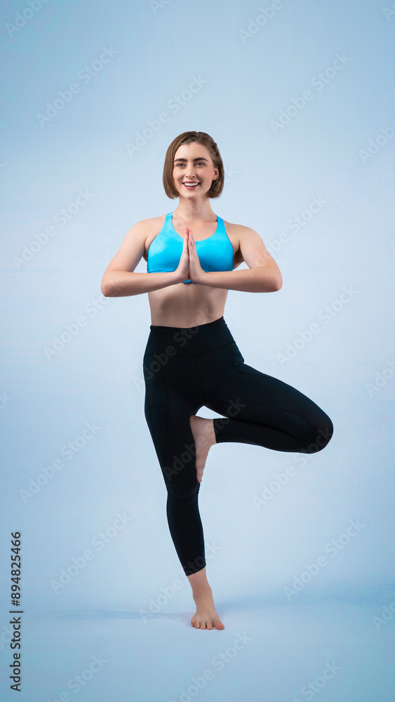 Full body length gaiety shot athletic and sporty woman doing healthy and meditative yoga exercise workout posture on isolated background. Healthy active and body care lifestyle Full body length gaiety shot athletic and sporty woman doing healthy and meditative yoga exercise workout posture on isolated background. Healthy active and body care lifestyle