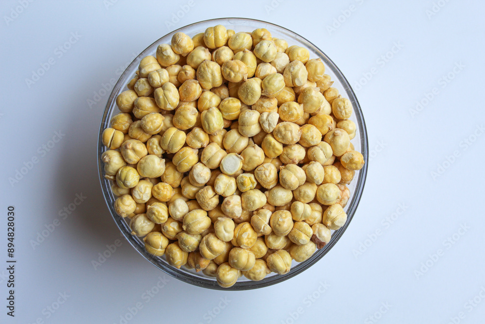 Chickpeas in glass transparent bowl, isolated on white background, flat lay or top view Chickpeas in glass transparent bowl, isolated on white background, flat lay or top view
