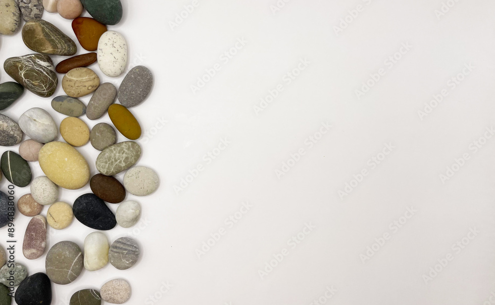 Sea stones on a white background. Lots of sea pebbles Sea stones on a white background. Lots of sea pebbles