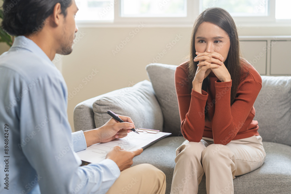 Psychology, depression. Suffer asian young woman consultation with psychologist while patient counseling mental therapy, doctor hand taking notes at clinic. Psychologist with sick mental health person Psychology, depression. Suffer asian young woman consultation with psychologist while patient counseling mental therapy, doctor hand taking notes at clinic. Psychologist with sick mental health person