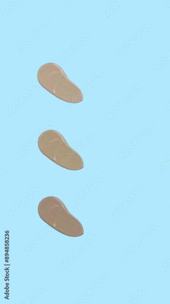 Swatch smearing foundation. 3 shades of Foundation, isolated on Blue vertical video stopmotion animation 4k Swatch smearing foundation. 3 shades of Foundation, isolated on Blue vertical video stopmotion animation 4k