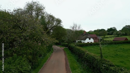 Wallpaper Mural Immerse yourself in the beauty of Brinkhill, UK, with aerial drone video. Red roofs, brick houses, thatched cottages, and rural farmlands create a scenic countryside vista. Torontodigital.ca